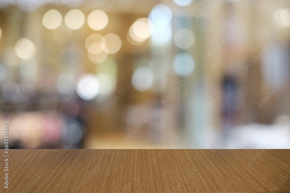 Empty dark wooden table in front of abstract blurred bokeh background of restaurant . can be used for display or montage your products.Mock up for space. Empty dark wooden table in front of abstract blurred bokeh background of restaurant . can be used for display or montage your products.Mock up for space.