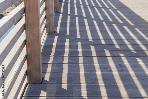 Railing Shadows on the wooden bridge for background.