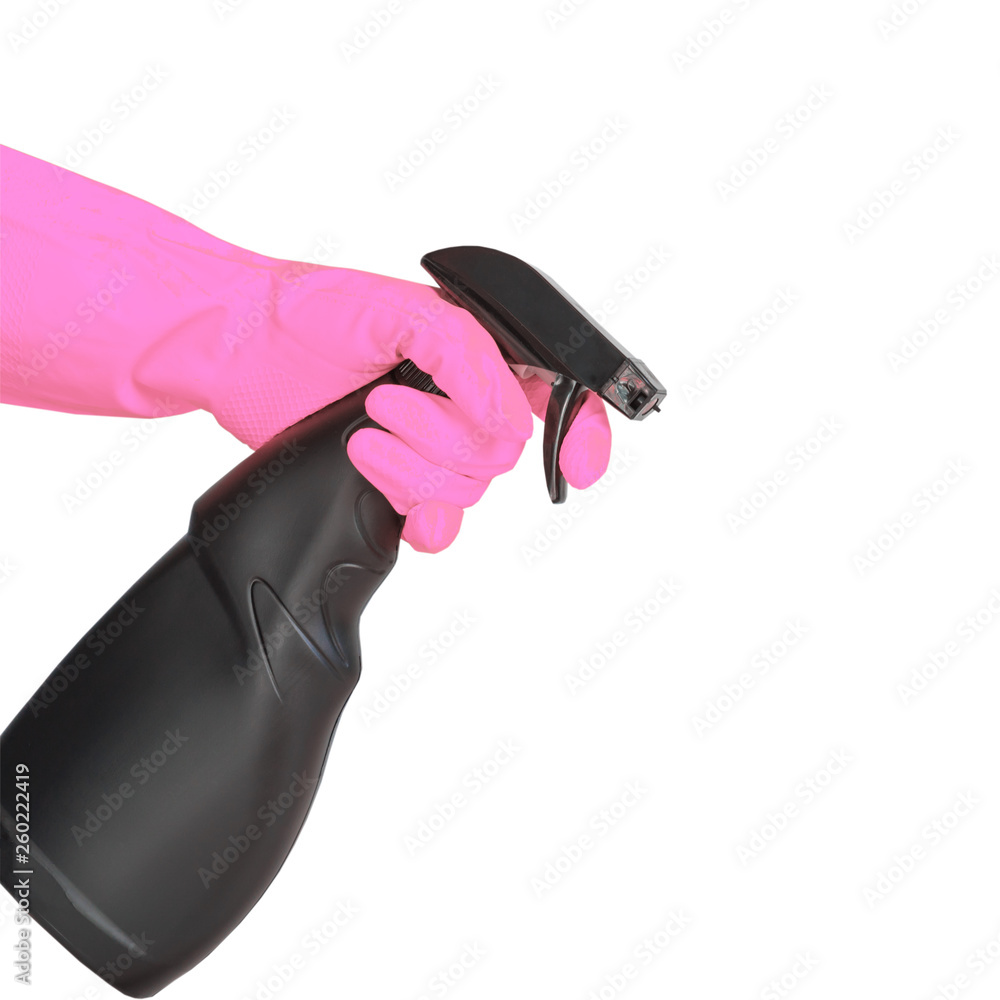 hand in pink rubber glove holding black plastic spray detergent bottle. Household chemicals. Cleaning product. hand in pink rubber glove holding black plastic spray detergent bottle. Household chemicals. Cleaning product.