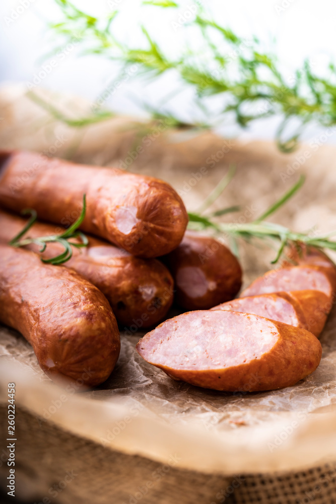 Thin sausage in composition with herbs, smoked sausage.