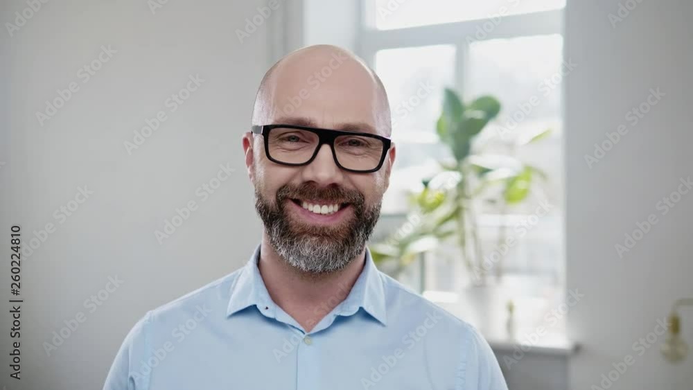Bearded middle-aged man wearing glasses Bearded middle-aged man wearing glasses