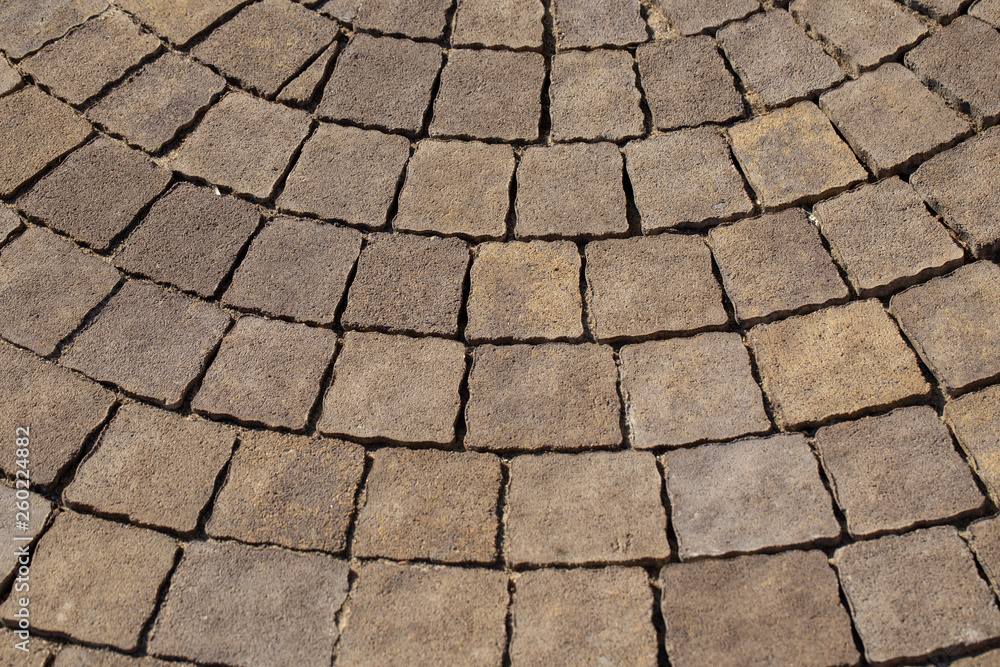 Closeup view of texture of brown paving stabs at sidewalk of city. Horizontal color photography. Closeup view of texture of brown paving stabs at sidewalk of city. Horizontal color photography.