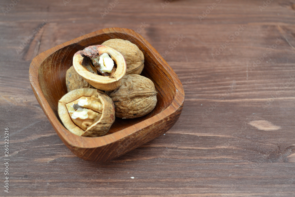 Lifestyle detox concept: organic walnuts on wooden table with copy space Lifestyle detox concept: organic walnuts on wooden table with copy space