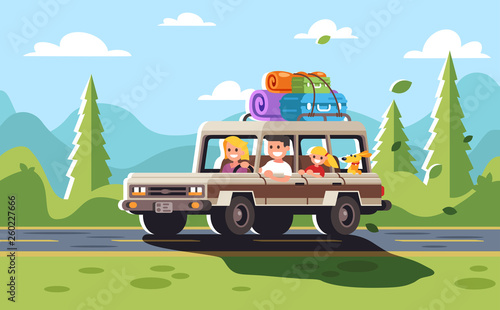 Young family with a child and a dog go on a trip by car