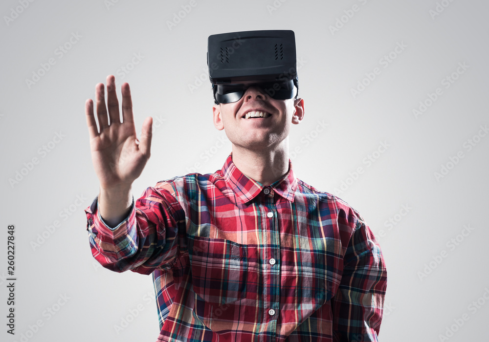 Guy in mask experiencing virtual reality as new entertainment device Guy in mask experiencing virtual reality as new entertainment device