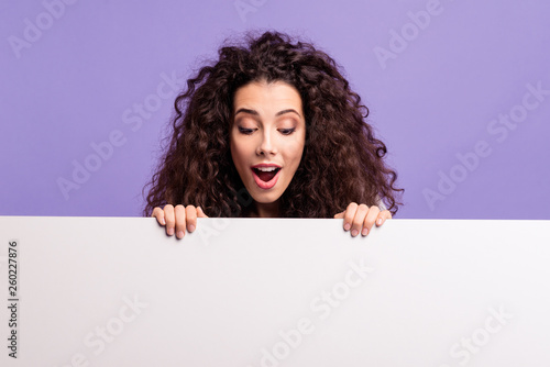 Close-up portrait of her she nice attractive cheerful girlish brunette wavy-haired lady showing big placard isolated over bright vivid shine violet purple background photo