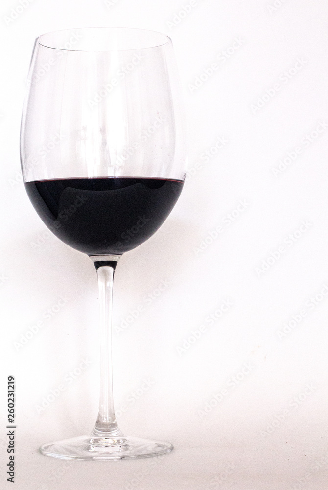 Glass of red wine with white background