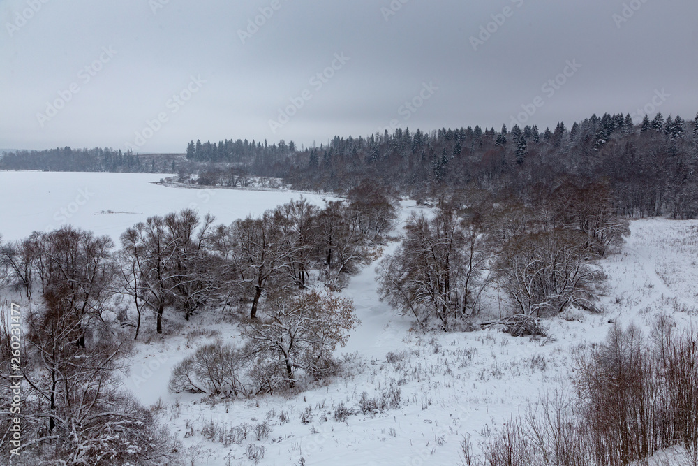 Winter landscape. River valley under the snow. Winter landscape. River valley under the snow.