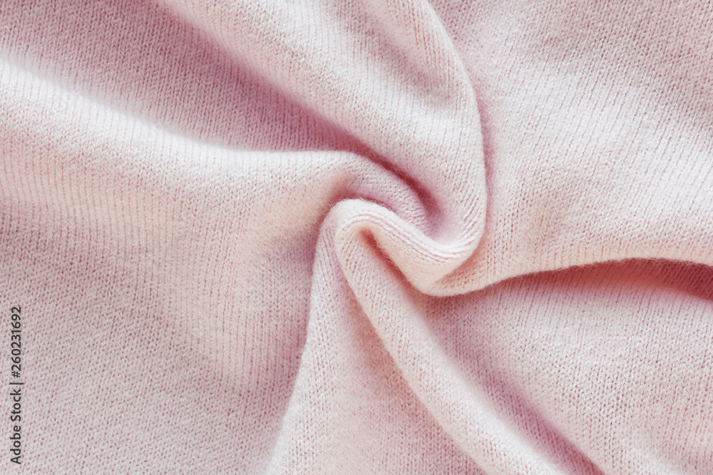 pink cashmere, texture knitted fabric with large folds pink cashmere, texture knitted fabric with large folds