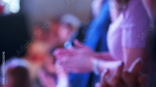 Hands with the crowd. People applause at the party. photo