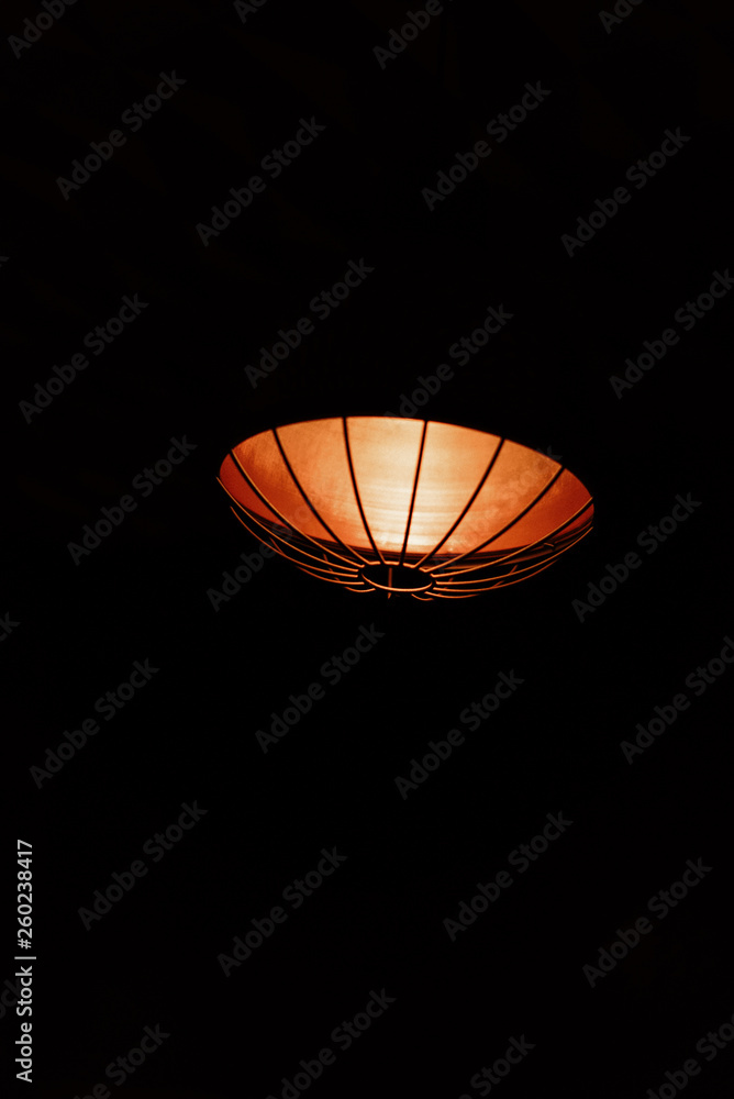 simple ceiling lamp on black background