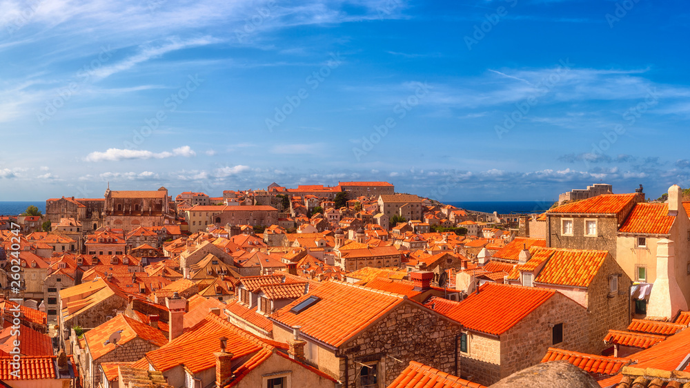 Dubrovnik Old City red tiled roofs, panoramic view from the ancient city wall, scenic cityscape. World famous and most visited historic city of Croatia, UNESCO World Heritage site, travel background