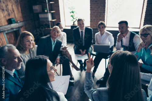 Nice classy stylish sharks sitting on chairs in circle discussing financial plan strategy development corporate conference at modern industrial loft interior room work place space