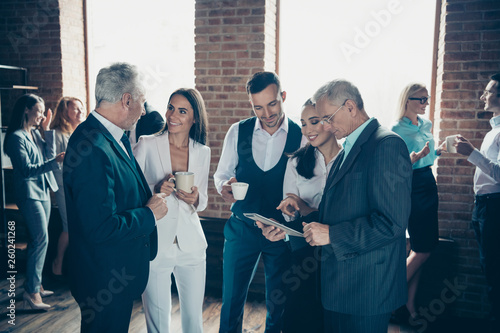 Close up photo morning diversity age mixed race business people stand she her he him his best brigade conversation tell speak listening reading beverage interested curious formal wear jackets shirts photo