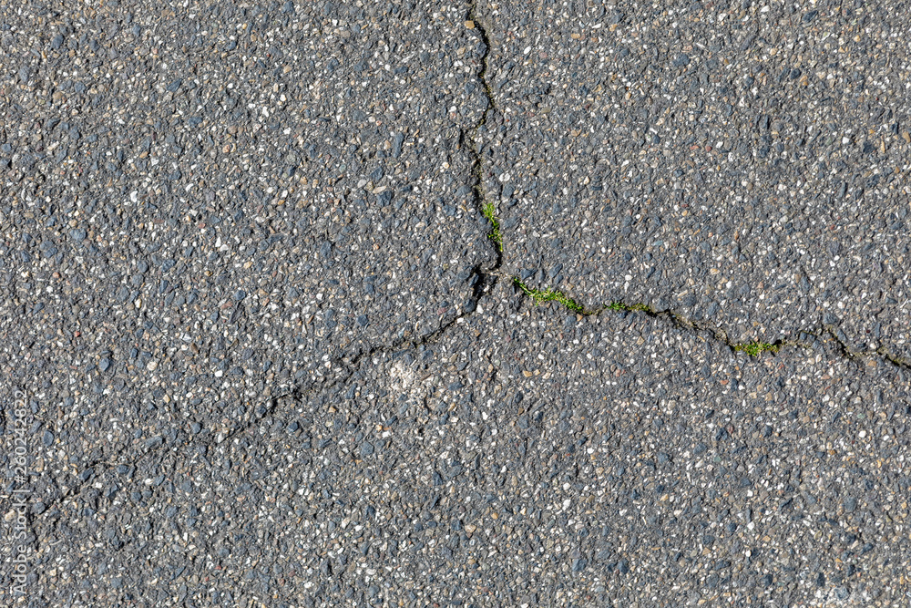 Obraz premium Risse im Asphalt, Straße