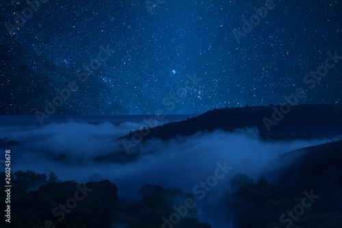 Night landscape with fog in valley