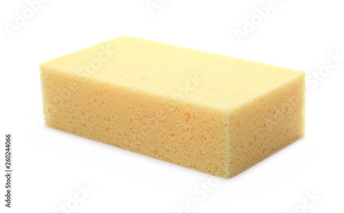 Yellow sponge for cleaning isolated on white background photo
