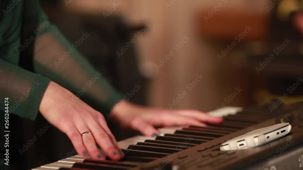 Play piano. Close up of female hands playing the piano. Fingers on the piano, vintage colors. A very close look at a jazz pianist's hands. Woman playing the piano, close-up. Play piano. Close up of female hands playing the piano. Fingers on the piano, vintage colors. A very close look at a jazz pianist's hands. Woman playing the piano, close-up.