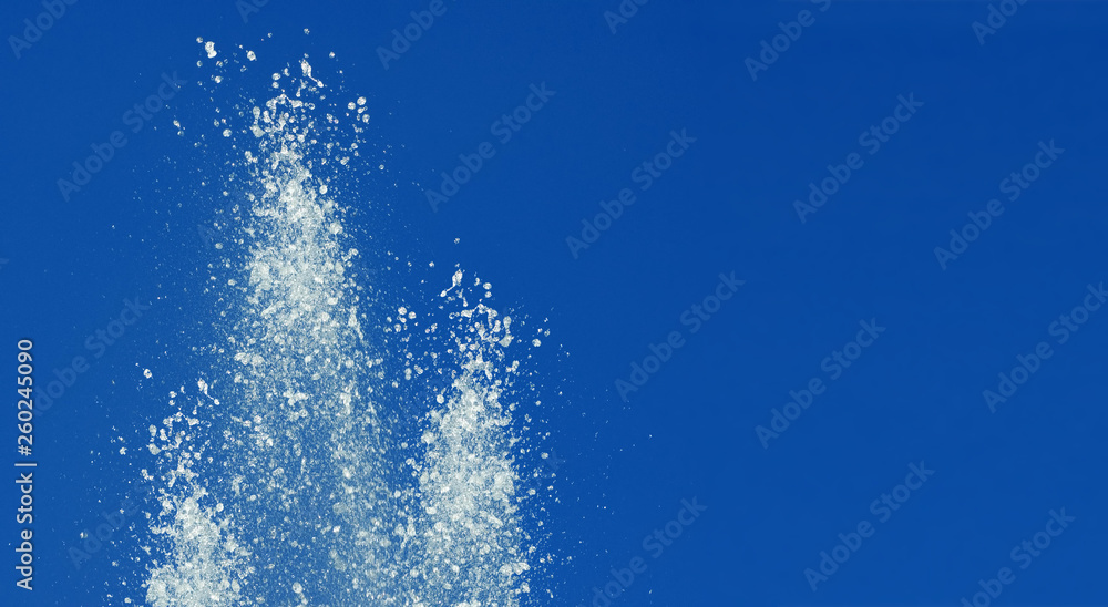 image of spray fountain on a blue background image of spray fountain on a blue background