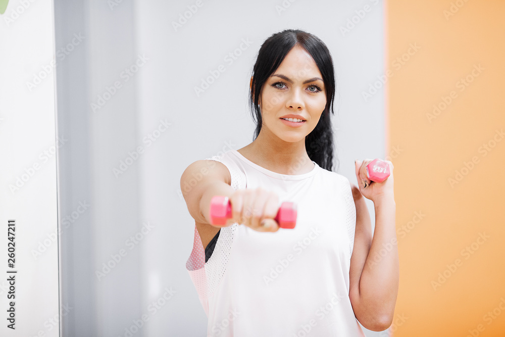 Fitness Girl. Sexy athletic girl working out in gym. Fitness woman doing exercise Fitness Girl. Sexy athletic girl working out in gym. Fitness woman doing exercise