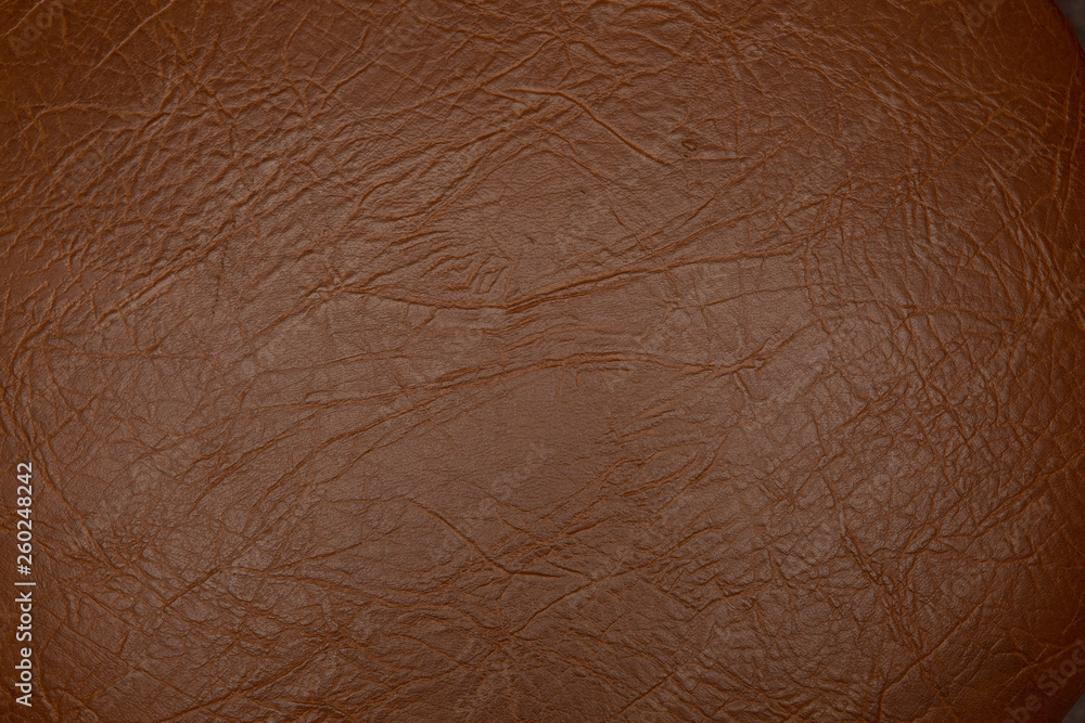 Fototapeta premium Texture of genuine leather close-up, brown color print. For your background, backdrop, with copy space 