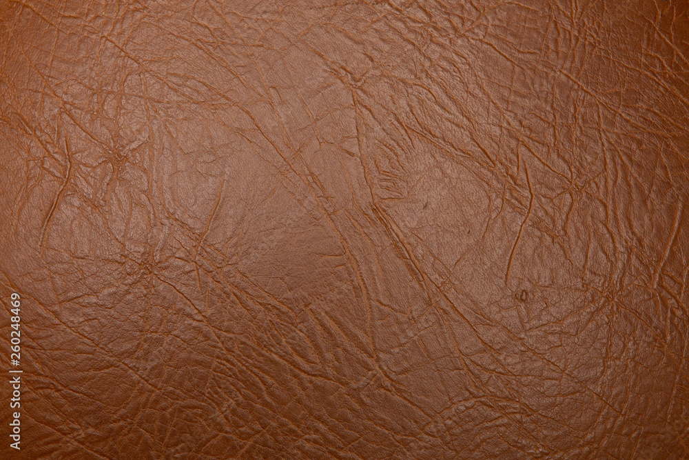 Texture of genuine leather close-up, brown color print. For your background, backdrop, with copy space Texture of genuine leather close-up, brown color print. For your background, backdrop, with copy space