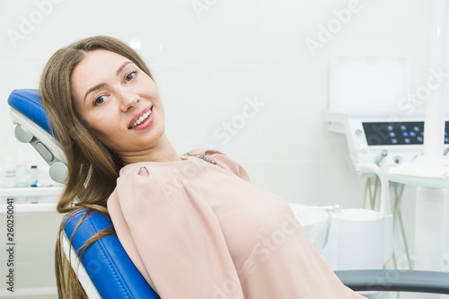 Dental clinic. Reception  examination of the patient. Teeth care. Young woman undergoes a dental examination by a dentist