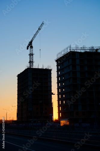 construction of the building cranes in the strongest light  otherwise