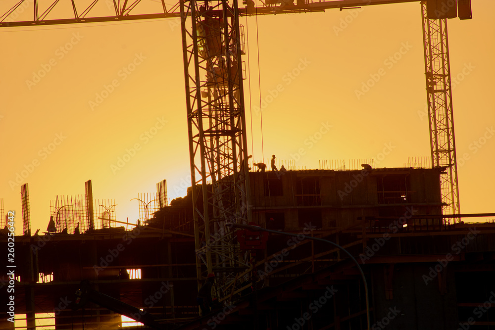 construction of the building cranes in the strongest light, otherwise