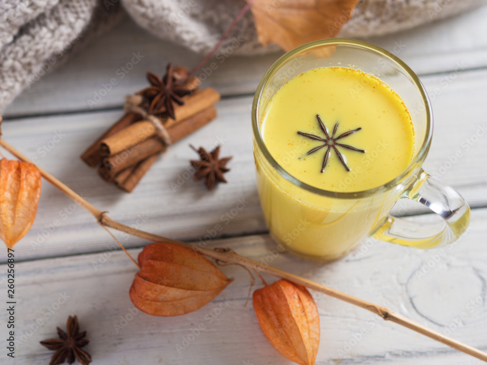 Fototapeta premium Golden milk or milk with turmeric. Alternative medicine of Eastern countries