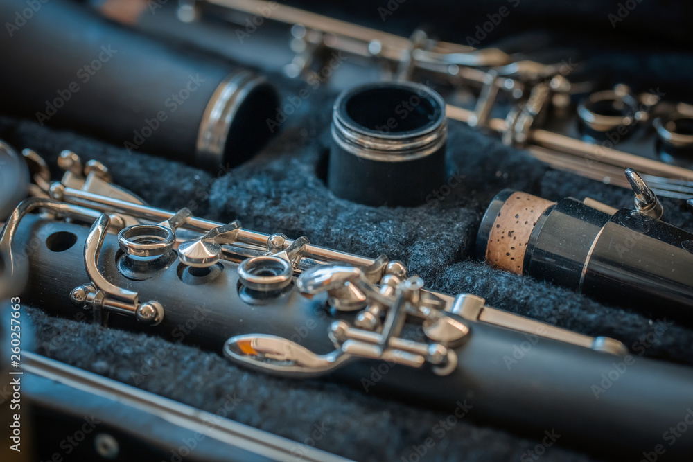 Naklejka premium macro old clarinet in bag on countertop in bazaar