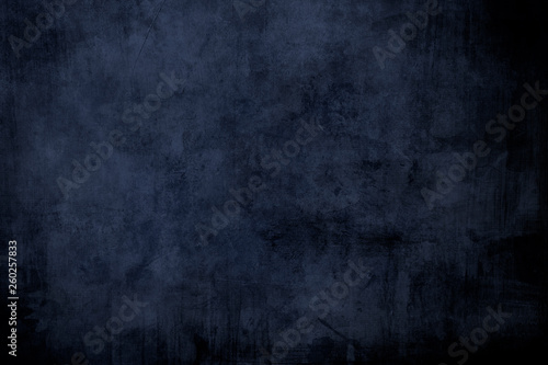 Dark blue grungy distressed canvas bacground