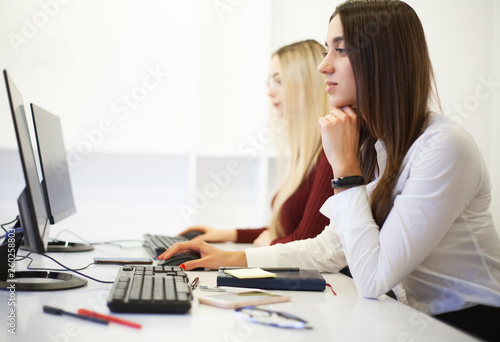 Two female colleagues in office working together. Two female colleagues in office working together