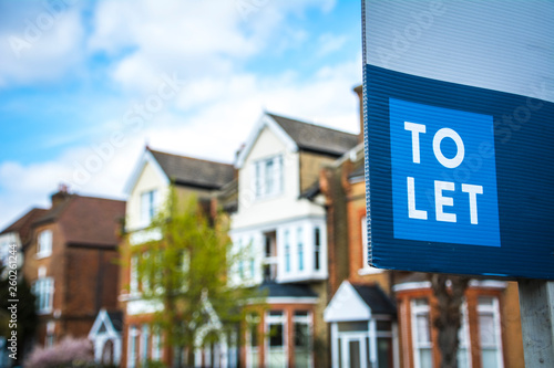 To Let sign on street of houses