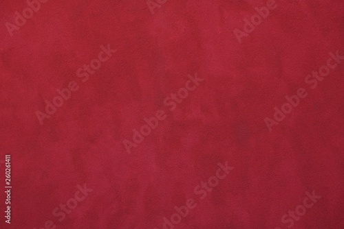 red paint background on stucco concrete wall