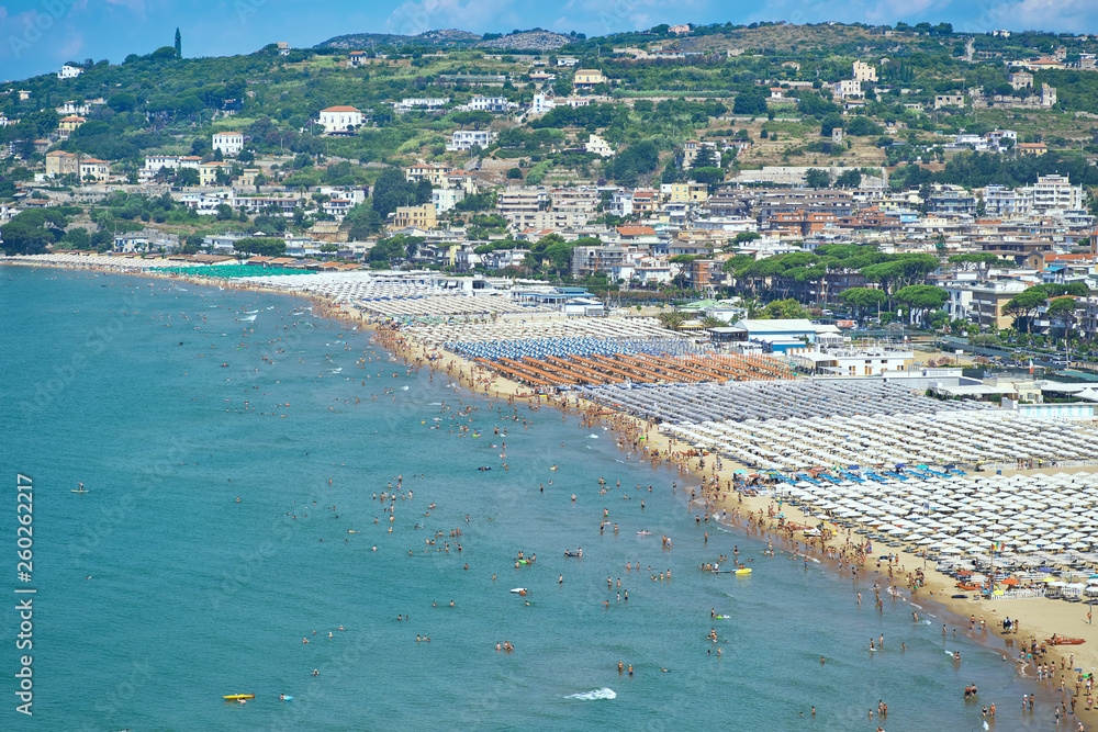 Top view of a sea beach and mountains in a summer sunny day