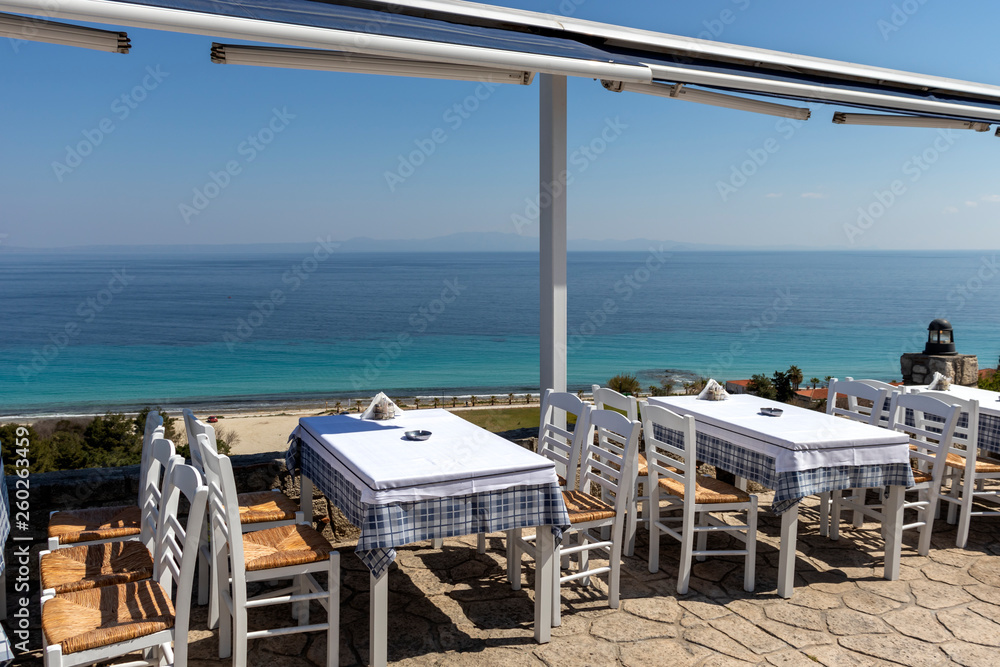 Typical Greek Restaurant at the coastline of town of Afytos, Kassandra, Chalkidiki, Central Macedonia, Greece