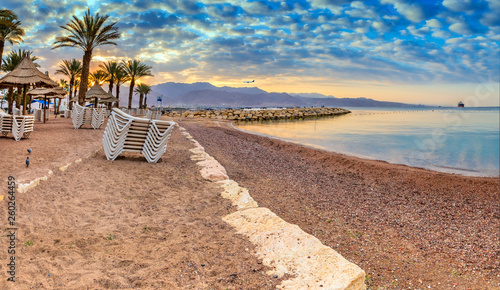 Morning atmosphere on sandy beach of Eilat - famous tourist resort and recreation city in Israel