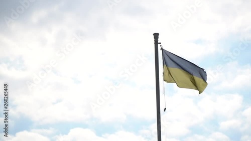 Flag of Ukraine. against blue sky, flag installed on flagpole in Kyiv