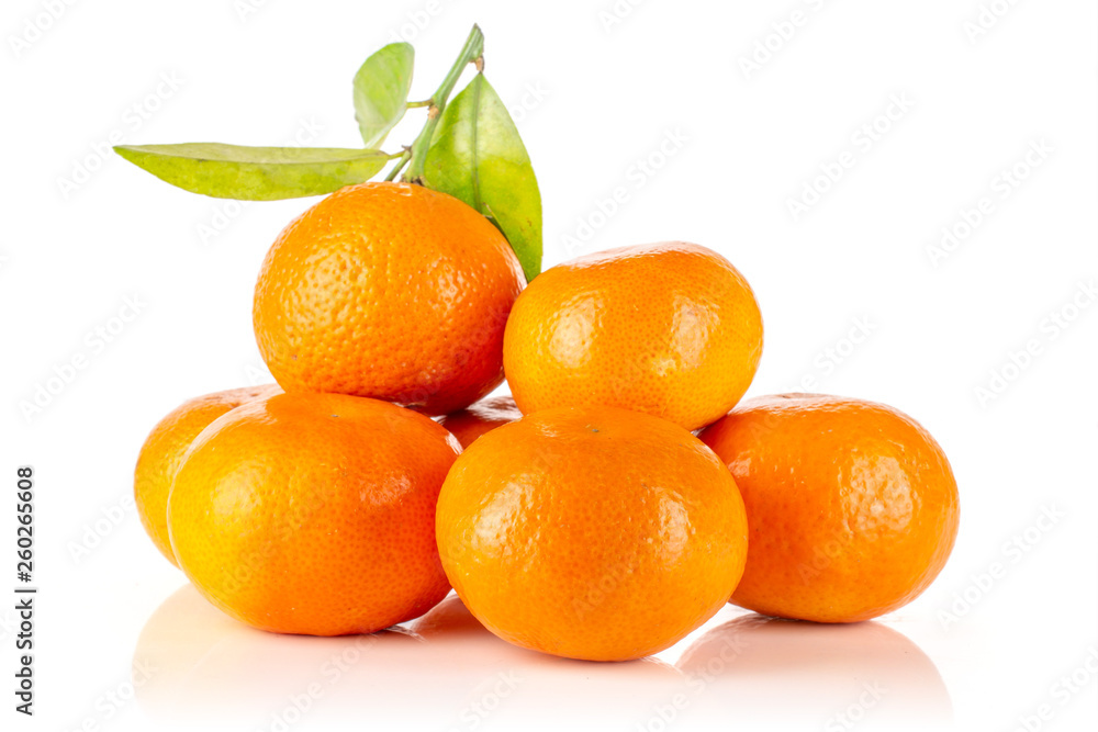 Lot of whole fresh orange mandarine with green leaves isolated on white background Lot of whole fresh orange mandarine with green leaves isolated on white background