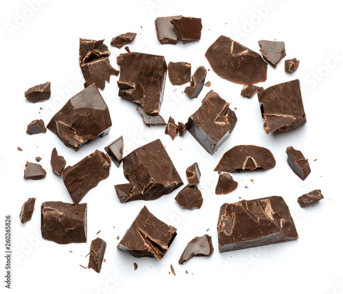 Dark or milk organic chocolate pieces isolated on white background
