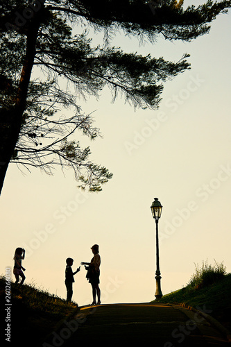Fototapeta Naklejka Na Ścianę i Meble -  silhouettes of people in the park