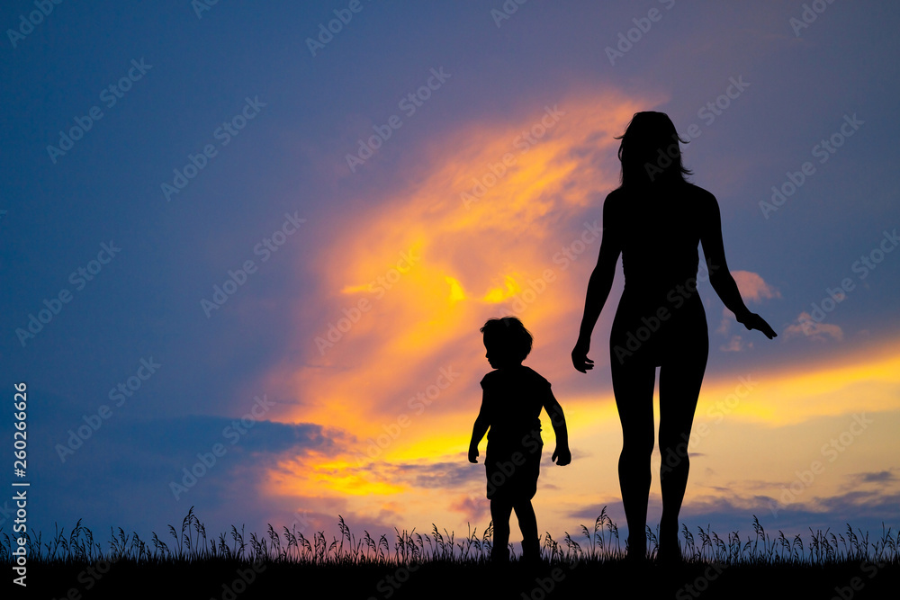 mom with her son at sunset