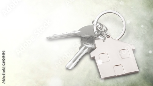 Silver Home key with badge on wooden table © BillionPhotos.com