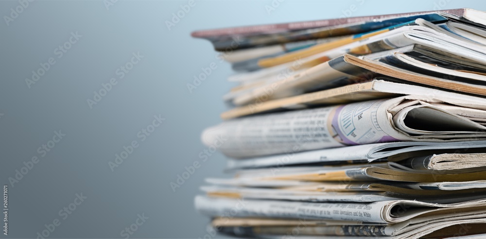 Obraz premium Pile of newspapers on white background