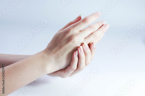 beautiful hands of a girl cream white background