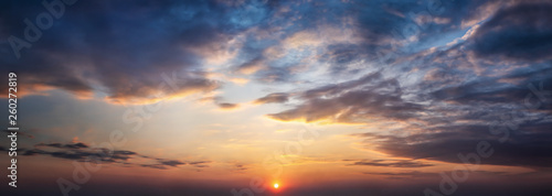 Dramatic sunset and sunrise sky. Orange, blue and yellow colors sunset. Panoramic view. photo