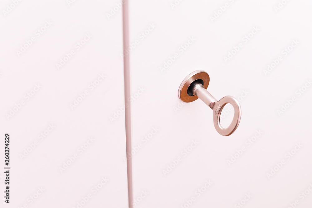 Metal key in the door Metal key in the door