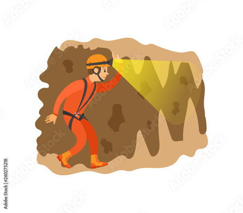 Man wearing helmet with light going in cave, male insurance going in antre, side view of person in orange suit, extreme or dangerous tourism vector
