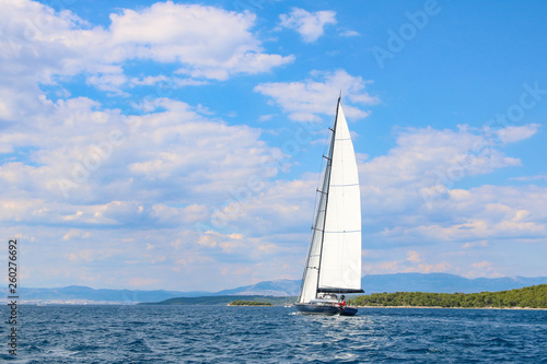 large sailboat in the Adriatic sea on blue and cloud sky background